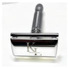 A silver metal safety razor with a textured handle and a polished blade engraved with the brand name 'KL GROOMING', shown on a plain white background.