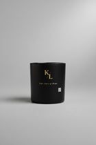 Love Letter from Harlem luxury soy candle in a black matte vessel by Kings & Lotus featuring citrus, cedarwood, musk, and tonka bean fragrance notes.