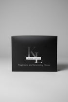 A black rectangular product box with the stylized 'KL' logo and the text 'KINGS + LOTUS' and 'Fragrance and Grooming House' on the front
